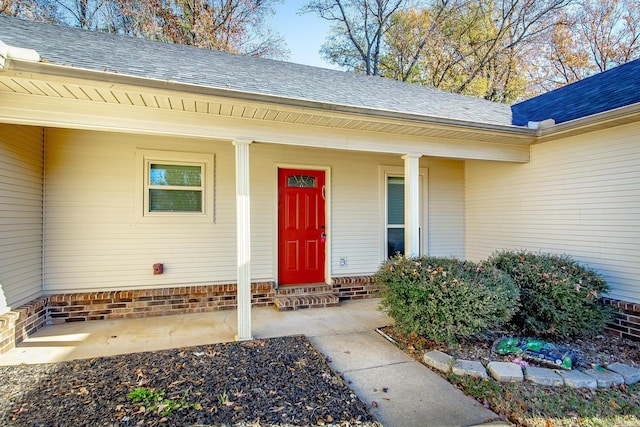 entrance to property with covered porch