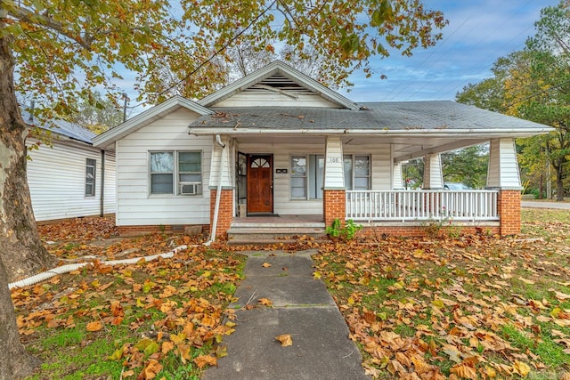 bungalow-style house with a porch and cooling unit