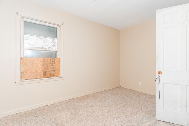 spare room with light colored carpet