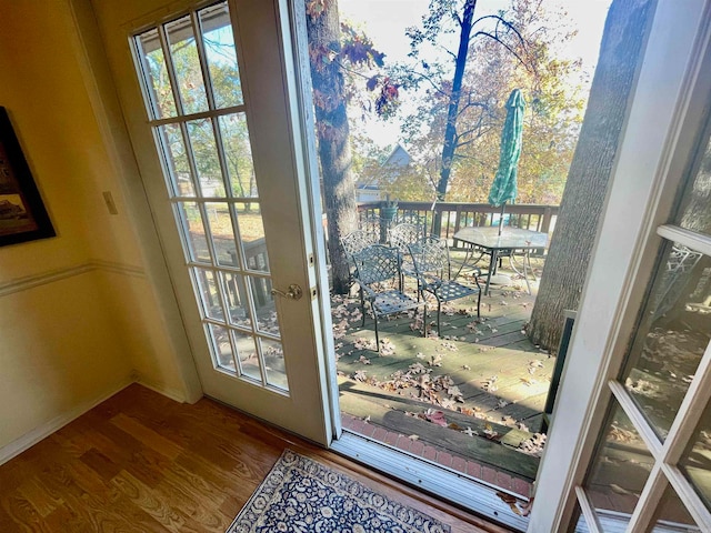 doorway to outside with hardwood / wood-style flooring