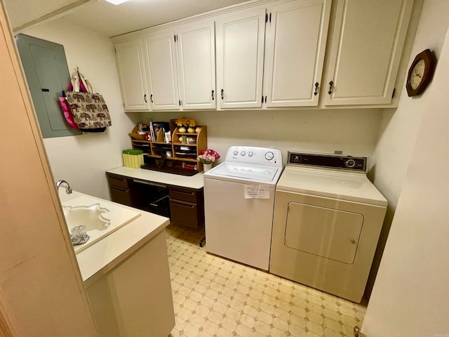 clothes washing area with electric panel and washer and dryer