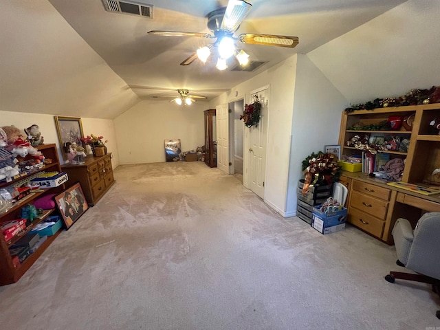 additional living space featuring vaulted ceiling, light colored carpet, and ceiling fan