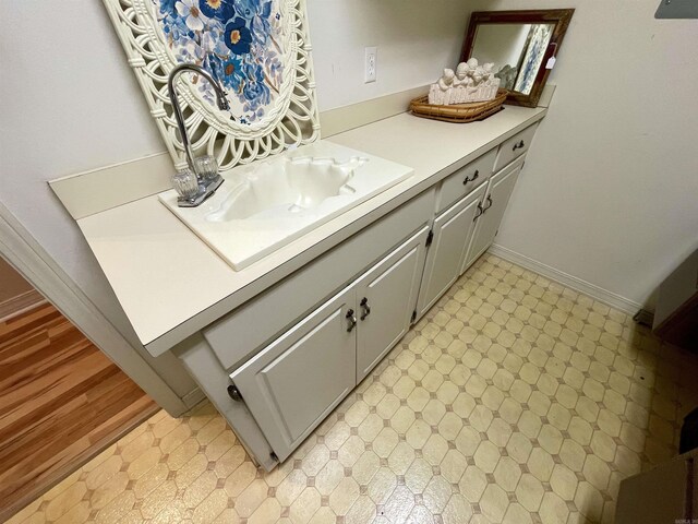 bathroom with vanity and wood-type flooring