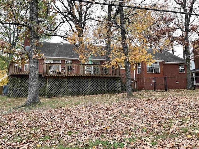 back of house with cooling unit and a deck