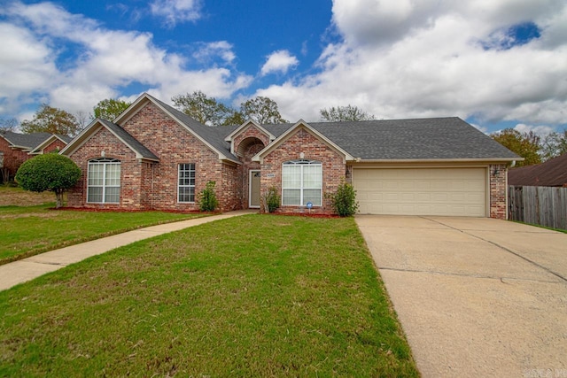 ranch-style home featuring a front yard and a garage