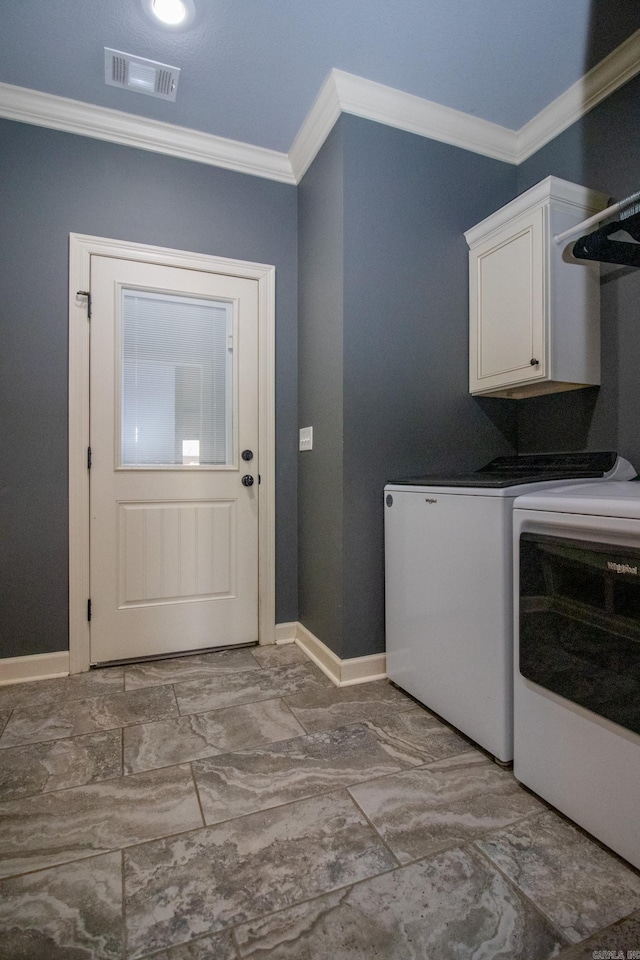 laundry area with cabinet space, visible vents, baseboards, ornamental molding, and washing machine and dryer