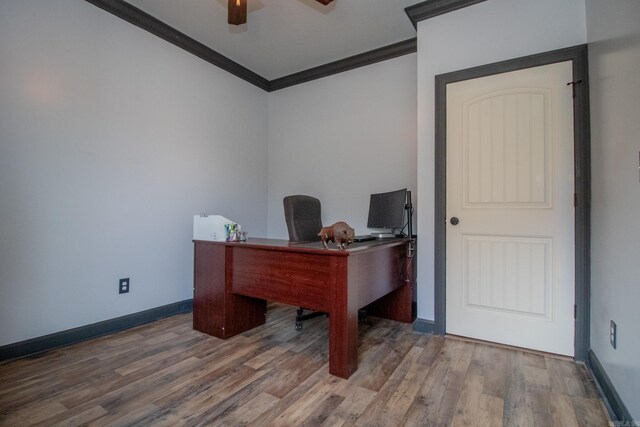 office space with a ceiling fan, baseboards, crown molding, and wood finished floors