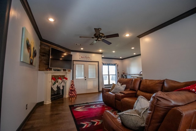 living room with ceiling fan, dark hardwood / wood-style flooring, and crown molding