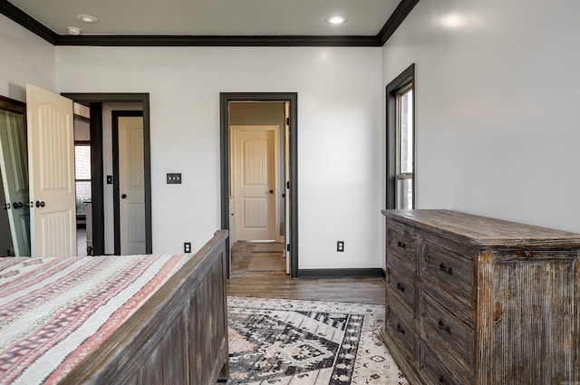 bedroom featuring recessed lighting, baseboards, crown molding, and wood finished floors