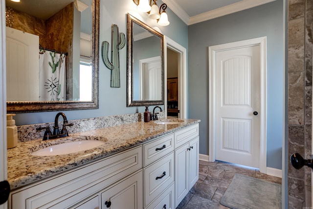 full bathroom with stone tile flooring, baseboards, ornamental molding, and a sink