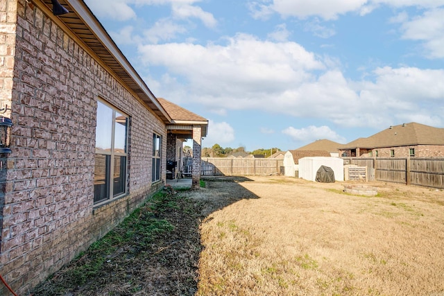 view of yard with a fenced backyard