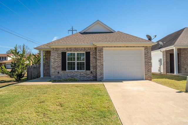 ranch-style home featuring a garage and a front lawn