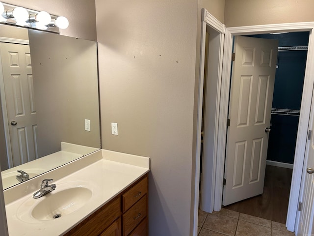 bathroom with tile patterned flooring and vanity