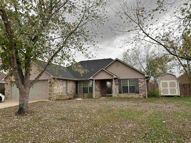 view of front of home featuring a garage and a storage shed