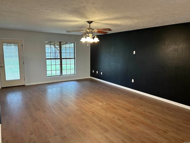 spare room featuring hardwood / wood-style floors, a textured ceiling, and ceiling fan