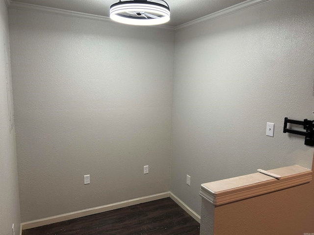 interior space with dark hardwood / wood-style flooring and ornamental molding