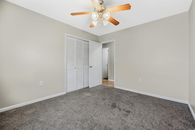 unfurnished bedroom with carpet flooring, a closet, and ceiling fan