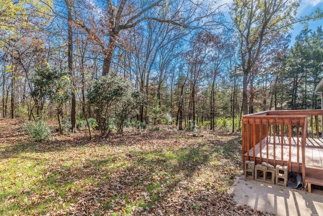 view of yard with a wooden deck