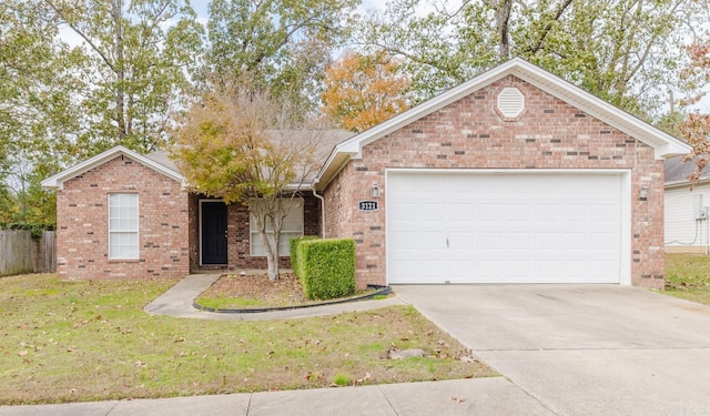 single story home with a front yard and a garage