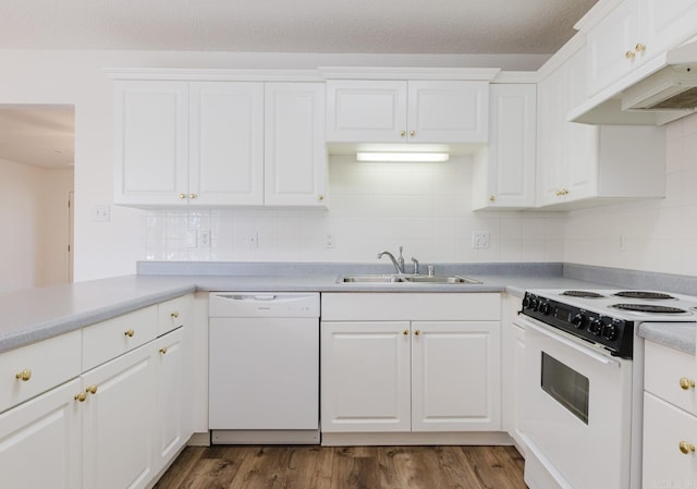 kitchen with dark hardwood / wood-style flooring, white appliances, white cabinetry, and sink