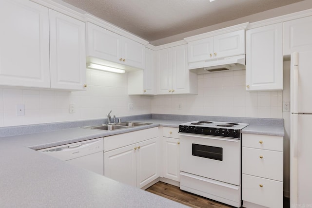 kitchen with white cabinetry and white appliances