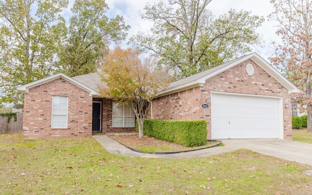 single story home featuring a front lawn and a garage