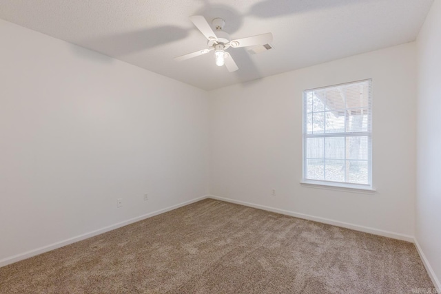 unfurnished room featuring ceiling fan and light colored carpet