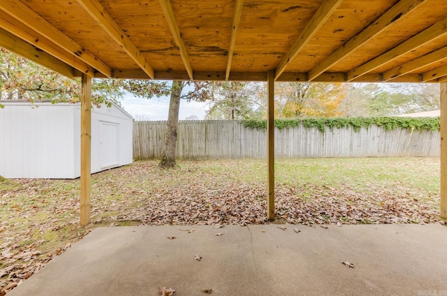 view of patio with a storage shed