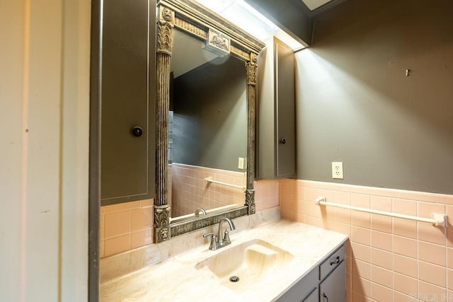 713 N Spring St, Searcy, AR 72143 - bathroom featuring vanity, a wainscoted wall, and tile walls