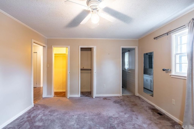 713 N Spring St, Searcy, AR 72143 - unfurnished bedroom with a textured ceiling, carpet floors, ornamental molding, baseboards, and connected bathroom