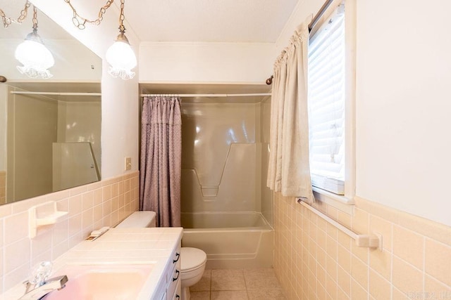 713 N Spring St, Searcy, AR 72143 - full bath featuring tile walls, toilet, tile patterned floors, vanity, and plenty of natural light