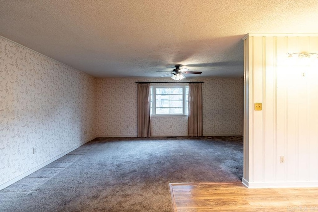 713 N Spring St, Searcy, AR 72143 - carpeted empty room featuring a textured ceiling, ceiling fan, and wallpapered walls