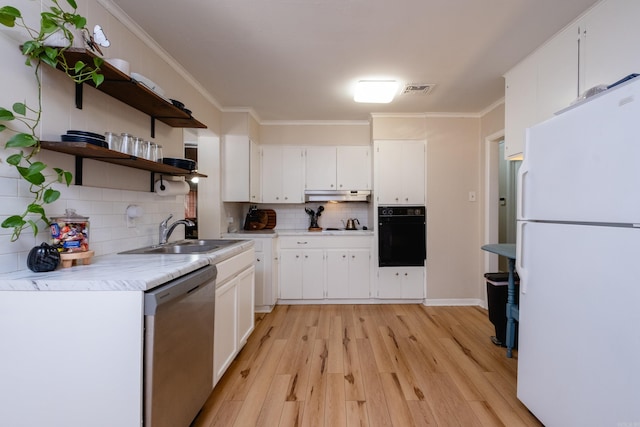 kitchen featuring white cabinets, dishwasher, oven, and white refrigerator