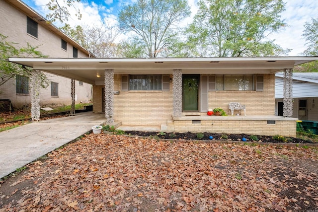 view of front of home with a carport