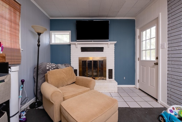 living area featuring a fireplace, crown molding, plenty of natural light, and light tile patterned floors