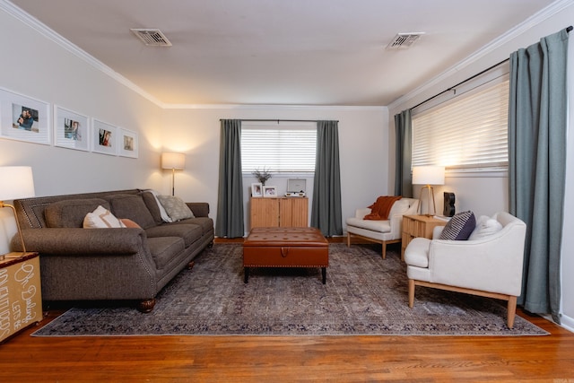 living room featuring dark hardwood / wood-style floors and crown molding