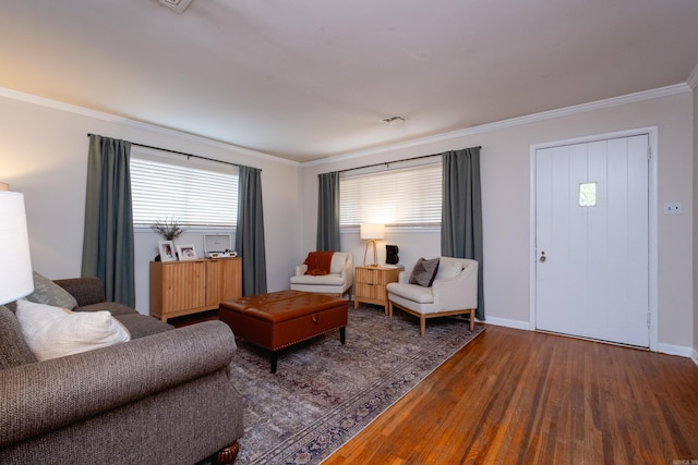 living room with ornamental molding and hardwood / wood-style flooring