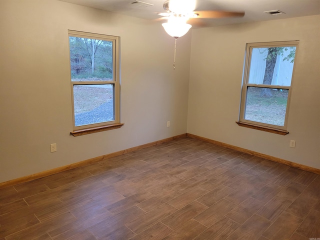 unfurnished room featuring hardwood / wood-style flooring and ceiling fan