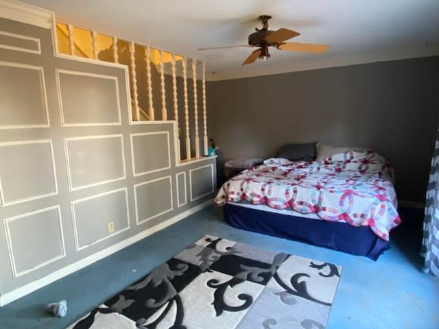 bedroom with ceiling fan, carpet, and ornamental molding