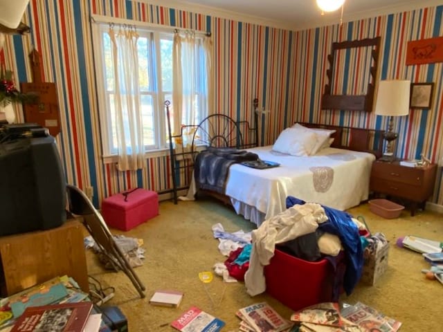 carpeted bedroom featuring ornamental molding