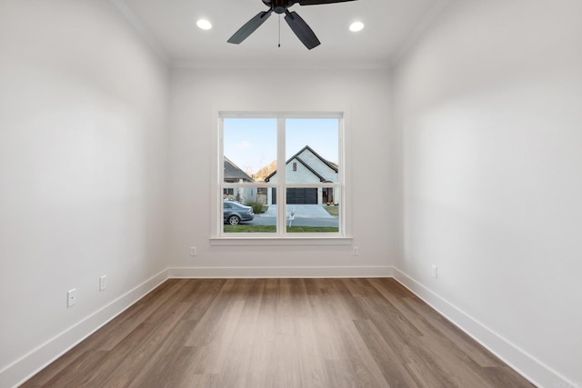 unfurnished room with ceiling fan, wood-type flooring, and ornamental molding