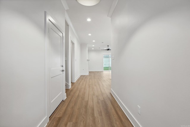 corridor with light wood-type flooring