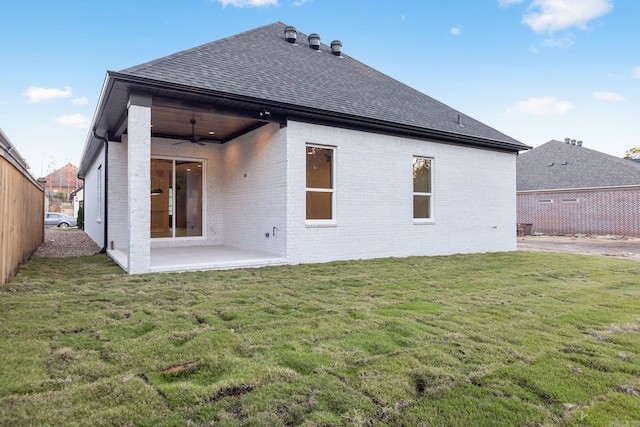 back of house featuring a yard, a patio, and ceiling fan