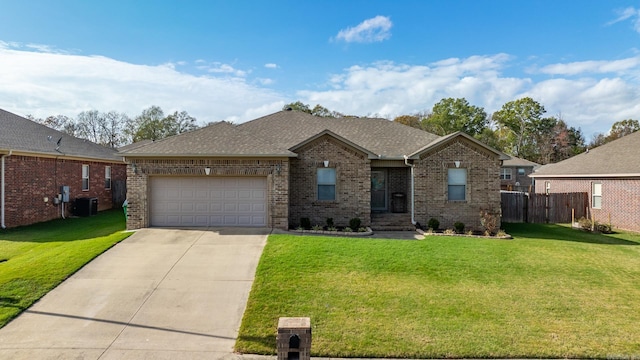 single story home with central AC unit, a garage, and a front lawn