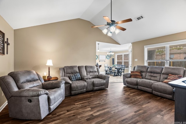 living room with dark hardwood / wood-style flooring, high vaulted ceiling, and ceiling fan with notable chandelier