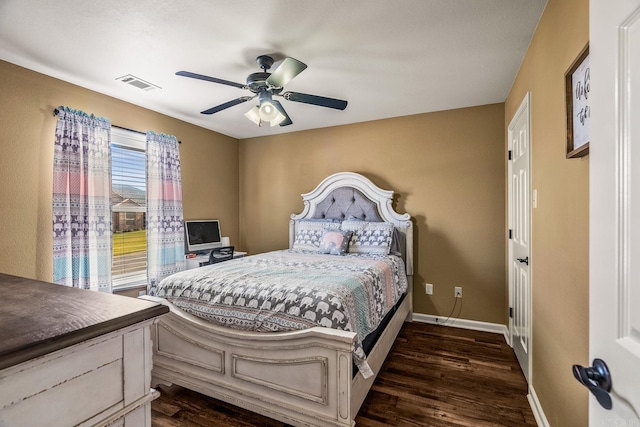 bedroom with ceiling fan and dark wood-type flooring