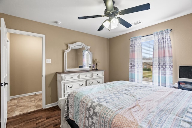 bedroom featuring dark hardwood / wood-style floors and ceiling fan