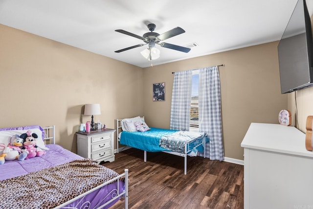 bedroom featuring ceiling fan and dark hardwood / wood-style flooring