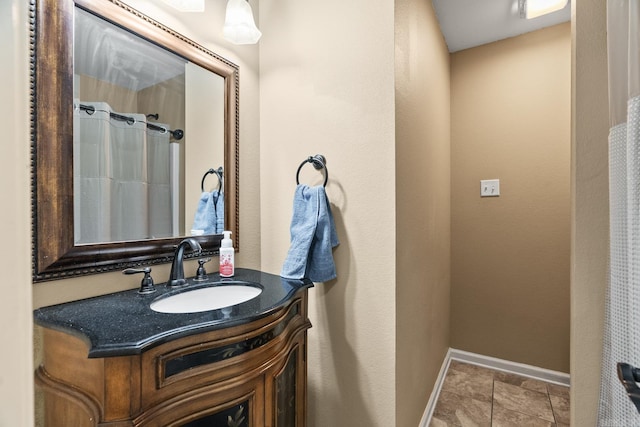 bathroom with tile patterned flooring and vanity