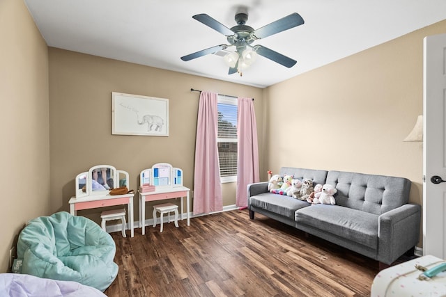 living room with dark hardwood / wood-style floors and ceiling fan